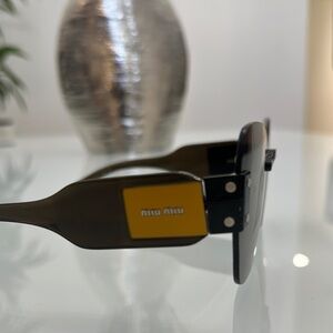 Miu Miu Black and Gold Sunglasses